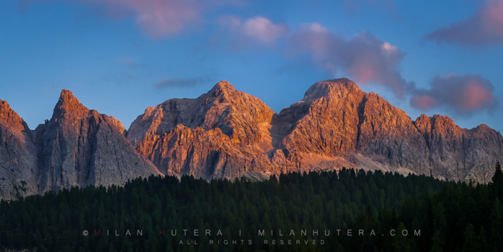 The Last Glow Last summer rays of Sun hit the massive cliffs near Misurina, in Dolomites, Italy.