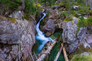 The waters of Studený potok (literally Cold Stream) run through a narrow rocky crack in the heart of High Tatras. This stream creates a series of waterfalls, this is the first of three.