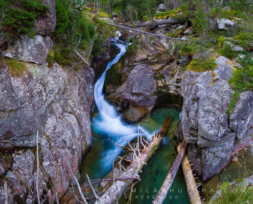 The waters of Studený potok (literally Cold Stream) run through a narrow rocky crack in the heart of High Tatras. This stream creates a series of waterfalls, this is the first of three.