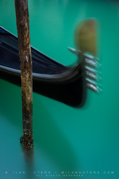 Long exposure of a gondola, tied to a pole. The waters were particularly green after a long rain and the color was further enhanced by circular polarizer.