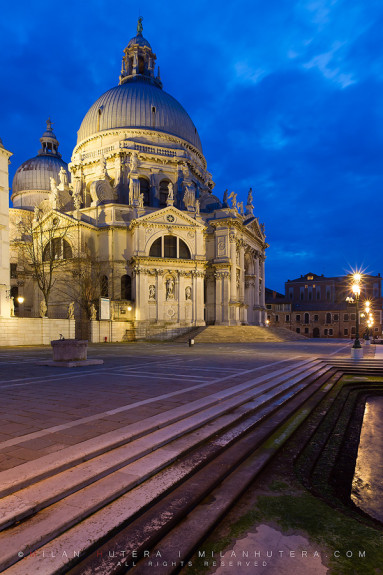 A late, cloudy March evening on the canal steps leading to Santa Maria della Salute, one of the most famous and most beautiful churches in Venice.