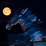 Moon rises above the impressive metal statue of a horse during the evening session of Summer Masters in Samorin, Slovakia.