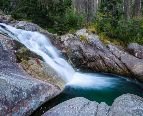 The waters of Cold Stream (Studenovodsky potok) runs through many rocky drops and into many small pools. Glacial water leaves beautiful turquoise color along the way.