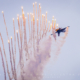 F-16 Fighting Falcon of the Royal Netherlands Air Force Demo Team releases decoy flares during the show at SIAF 2014, Slovakia.