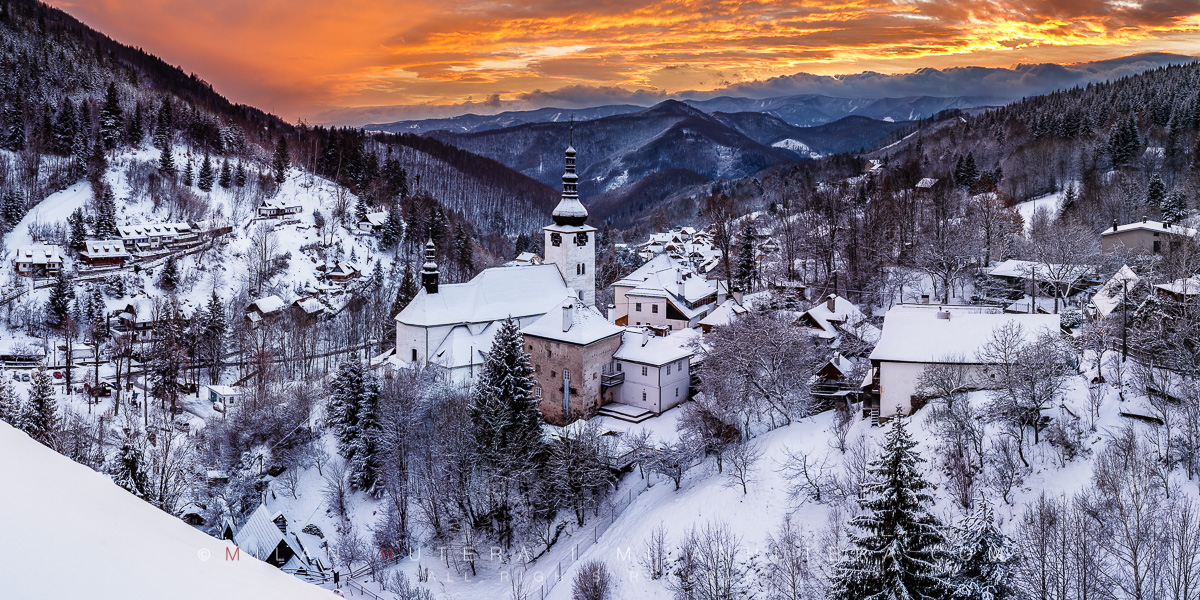 An incredible display of sunset colors at the famous overlook of Spania Dolina. The entire valley received a decent snowfall the very same day. Spania Dolina is a famous mining village in Central Slovakia. The hill in the middle of the village houses the Church of Transfiguration.