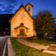 Blue hour at tiny Chiesa di San Francesco (Church of Saint Francis) in Cortina d'Ampezzo, Dolomites, Italy. It dates back to 1396 when it's mentioned for the first time in a contract of sale. It's located right next to main street loop running through the Cortina.