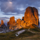 A brief warm sunrays hit the famous towers of Cinque Torri mountain on a cloudy september evening. The beautiful sunset light lasted for only about a minute, then the opening in the clouds closed and never reappeared that day.