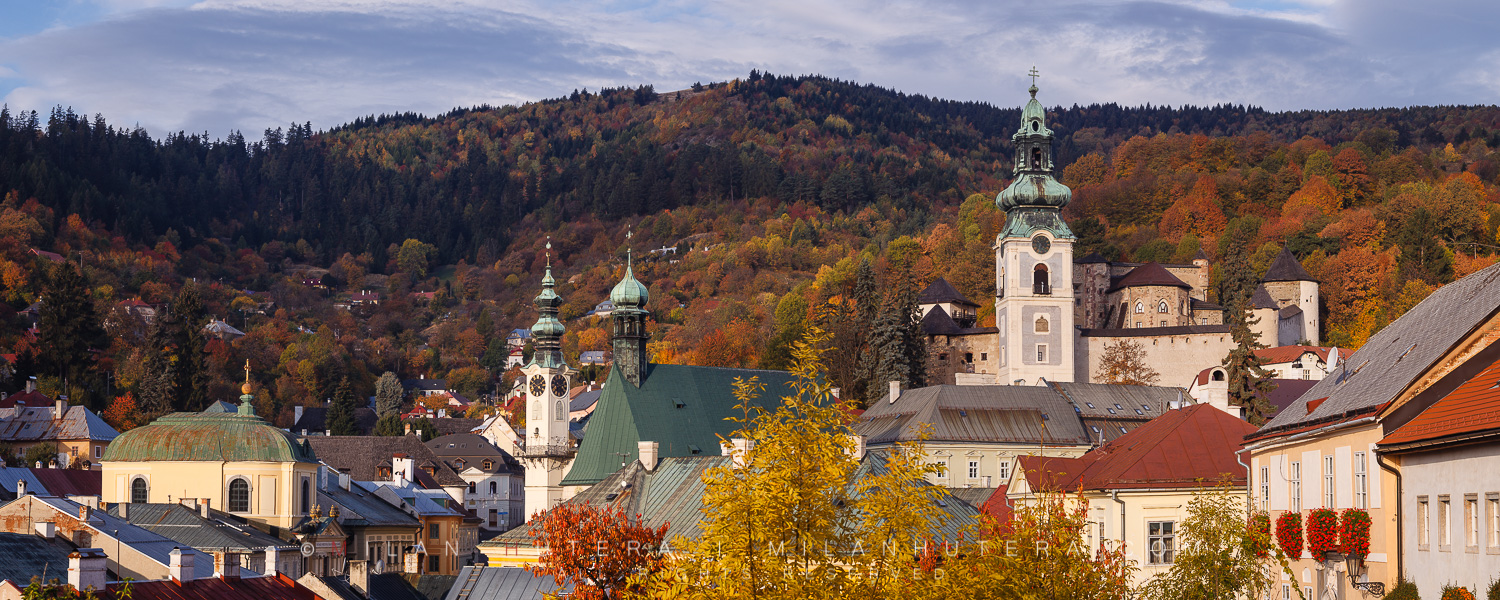 A morning panorama of Banska Stiavnica, a very old mining town located in Central Slovakia and a part of UNESCO World Heritage Site. The displayed town landmarks are: Old Castle (Right), The Church of Saint Catherine (Center) and Evangelical Temple (Left)
