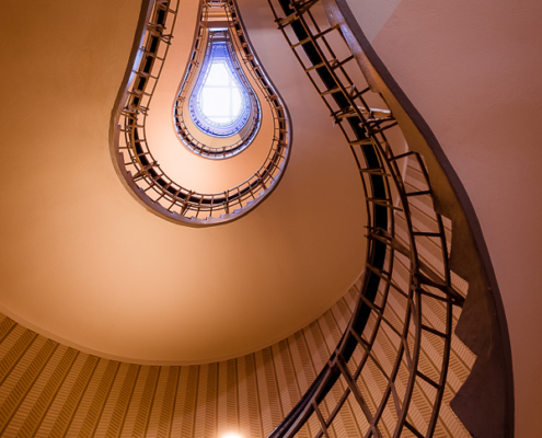 The house of Black Madonna is a prime example of cubist architecture, designed by Josef Gočár in 1911. The spiral staircase is one of the many cubist treasures hidden both inside and outside of the building. When looked at from the proper angle, it indeed looks like an incandescent light bulb.