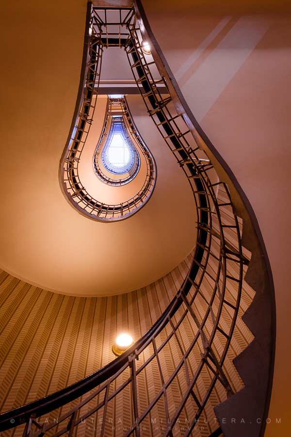 The house of Black Madonna is a prime example of cubist architecture, designed by Josef Gočár in 1911. The spiral staircase is one of the many cubist treasures hidden both inside and outside of the building. When looked at from the proper angle, it indeed looks like an incandescent light bulb.