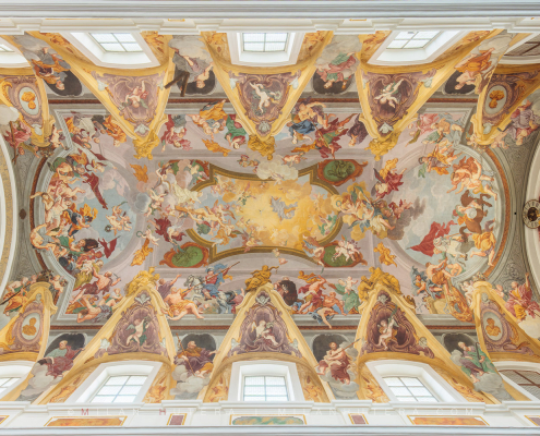 Symmetrical photograph of the Baroque Ljubljana Cathedral ceiling fresco by Giulio Quaglio