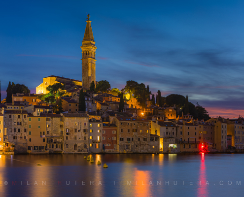 Panoramic photograph of Rovinj Croatia showing the transition from twilight sky to night city lights