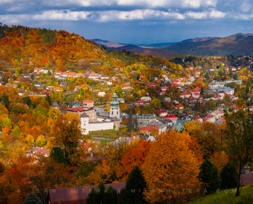 Banska Stiavnica autumn panorama with the Old Castle and the restored Calvary on the hill, captured in October 2019.
