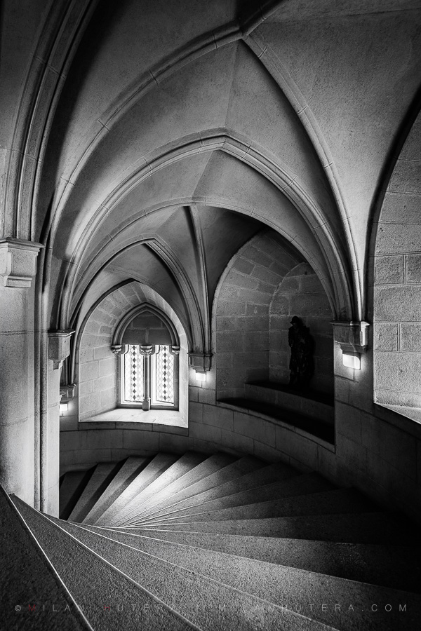 Black and white photography of 137 stone steps and Neo-Gothic arches in the Middle Castle of Bojnice.