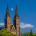 Vyšehrad Moonrise showing a daytime moon between the twin towers of the basilica in Prague.