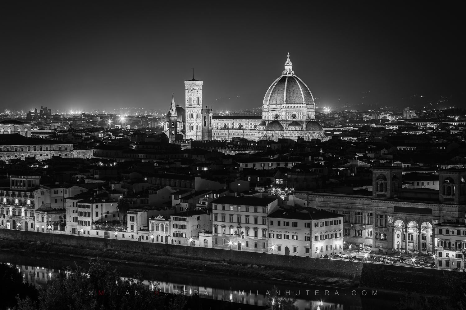 Florence night skyline view in black and white taken from Piazzale Michelangelo showing the illuminated Santa Maria del Fiore Cathedral and the city of Florence