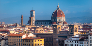Florence rooftops morning panorama with golden light hitting the Santa Maria del Fiore and surrounding towers