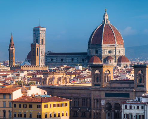 Florence rooftops morning panorama with golden light hitting the Santa Maria del Fiore and surrounding towers