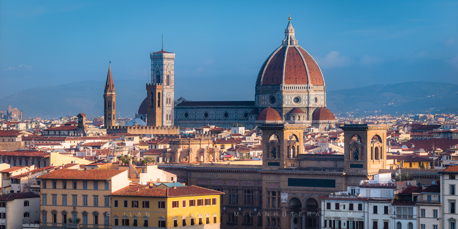 Florence rooftops morning panorama with golden light hitting the Santa Maria del Fiore and surrounding towers