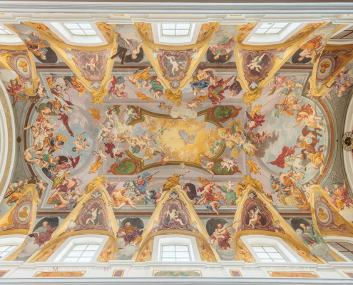 Symmetrical photograph of the Baroque Ljubljana Cathedral ceiling fresco by Giulio Quaglio