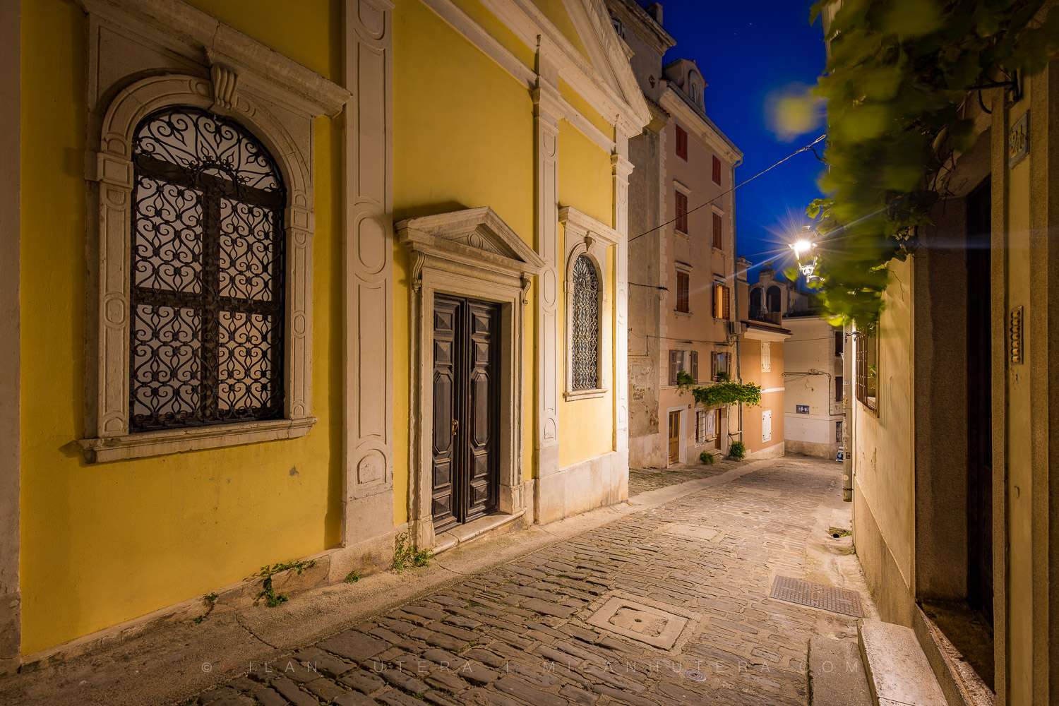 Piran alleyways twilight view of the historic Church of Our Lady of Consolation on IX. korpusa street.