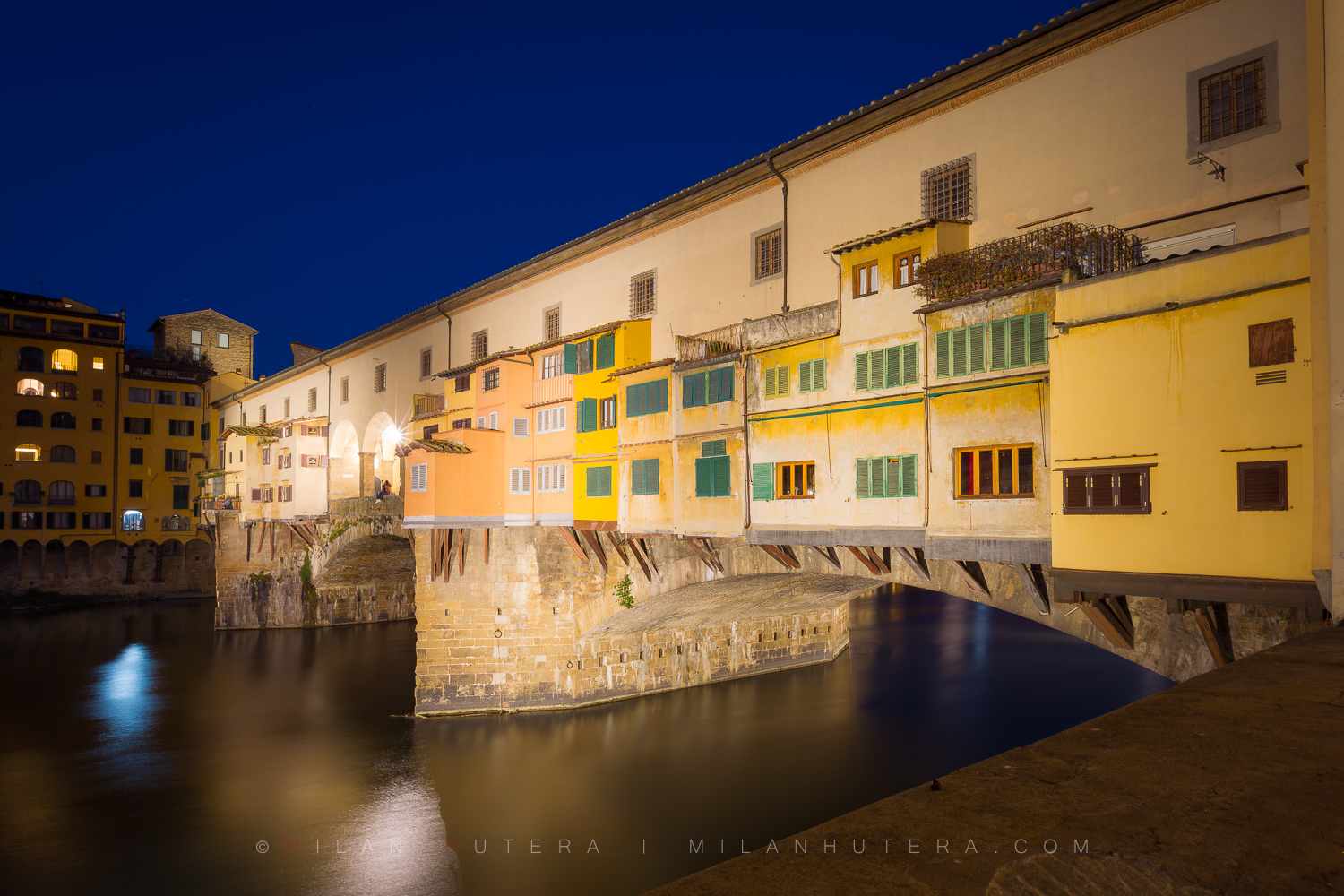 Ponte Vecchio in Florence, Italy, during the blue hour before sunrise in a long exposure photograph