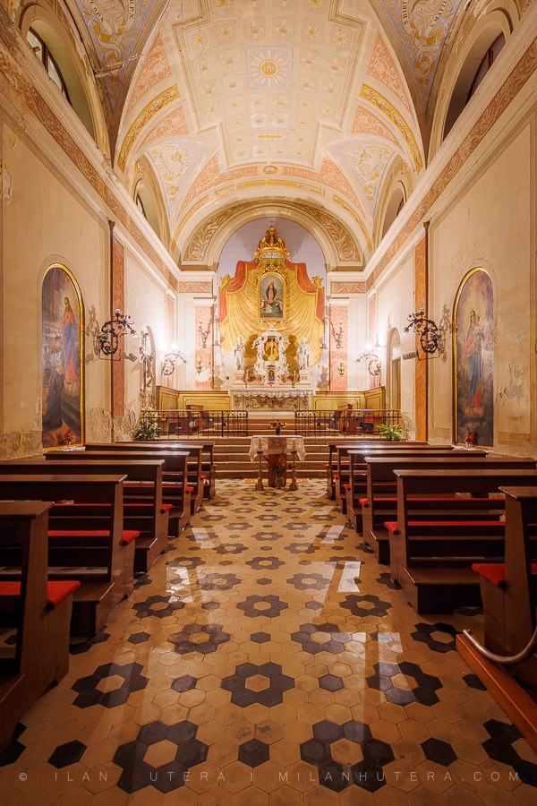 An evening view of the interior of St. Peter's Church, located on Tartini Square in Piran, Slovenia