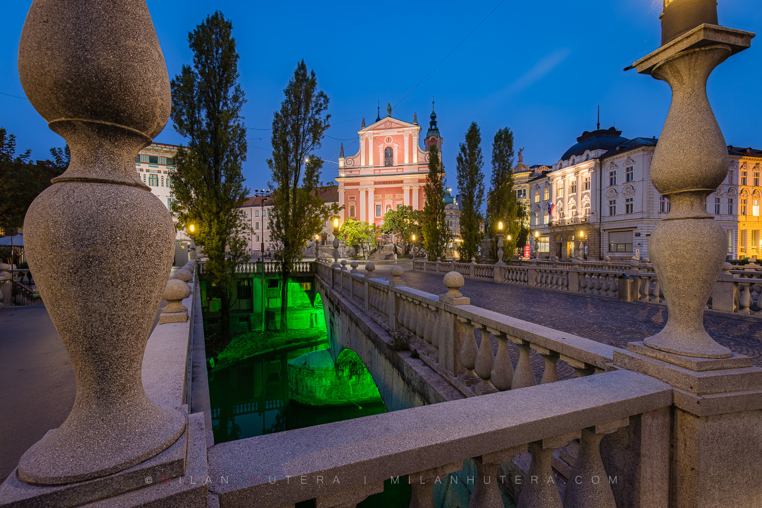 The Triple Bridge in Ljubljana, Slovenia, captured completely empty at dawn with morning light.
