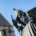 Low-angle view of the Gregory of Nin statue in Split with the bell tower of St. Arnir in the background